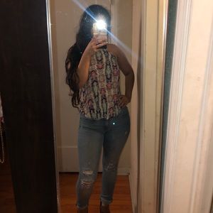 Loose fitting sleeveless blue toned blouse